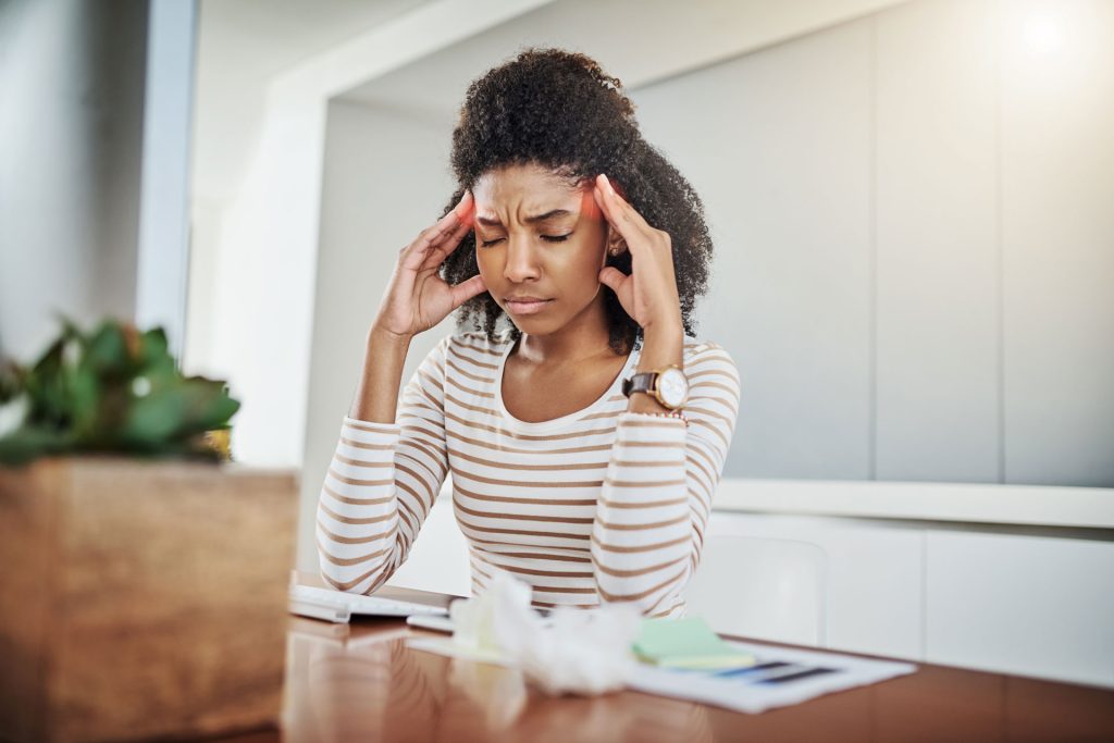 A young woman having migraines.