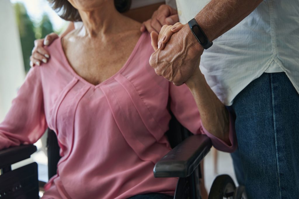Husband supporting his wife with a disability.